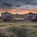Worldmark Long Beach in Long Beach at sunset, set beyond grassy dunes
