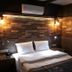 The Sarigerme Inn in Sarigerme room with a double bed, brick accent wall, and wall lamps
