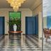 Grand Hotel Miramare in Santa Margherita Ligure lobby with chandelier, checkered floor and garden view