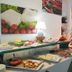 Hotel Marinella in Ricadi breakfast buffet with assorted dishes and fresh food spread on a table