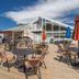 Mountainside Villas at Massanutten by TripForth in McGaheysville: outdoor deck with tables, umbrellas and mountain views