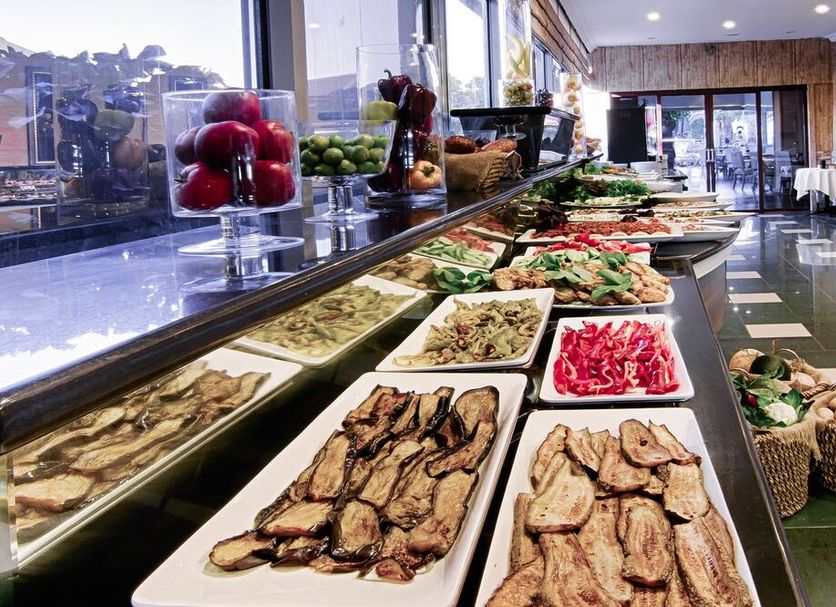 Romance Beach Hotel Marmaris buffet with assorted dishes and fresh fruit in a dining area