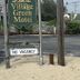 Village Green Motel in South Yarmouth sign with No Vacancy notice by the roadside