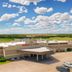 Quality Inn Rosebud Casino in Mission with casino entrance, parking lot, and prairie landscape