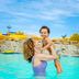 Margaritaville Lake Resort Lake of the Ozarks pool with woman lifting child in Osage Beach