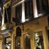 Hotel Colvenier in Antwerp at night, with lit facade, flags, and ornate balconies