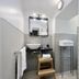 Youroom Corsini Rome bathroom with vessel sink, mirror, towels, and folded linens on a stool