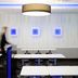 Ibis Budget Marne la Vallée in Saint-Thibault-des-Vignes meeting room with white tables and blue-lit wall art