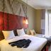 ibis Paris Tour Montparnasse 15ème room in Paris with double bed, daybed, desk and window light