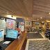 Le Cairn in Les Deux-Alpes lobby with reception desk, seating area, and decorative artwork