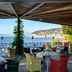 Grand Hotel Ambasciatori in Sorrento rooftop terrace with sea views, Mount Vesuvius and tables set for dining