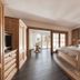 Klein Fein Hotel Anderlahn in Parcines: wooden bedroom with king bed and balcony view