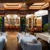 Seda Club Hotel in Granada lounge dining room with bar, arched shelving, and warm ceiling lights