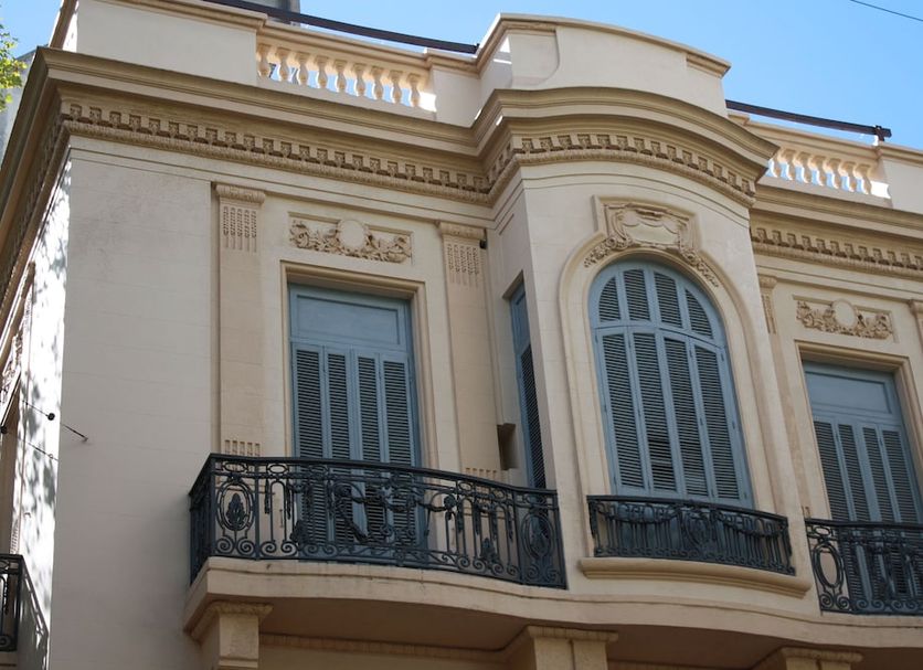 Hotel Ideal in Montevideo, ornate historic facade with balcony and tall arched windows