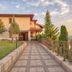 Park Hotel Arbanassi in Arbanasi with a tiled walkway, landscaped grounds and sunset views