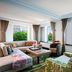 The Ritz-Carlton New York Central Park suite with large windows and views of Central Park