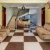 Hotel Royal Nest, Entebbe lobby with checkered floor, sofas, staircase and front desk