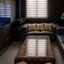Le Charme Suites Subic in Olongapo, dark lounge with black leather sectional and coffee table