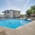 Motel 6 Lakewood, Co - Denver outdoor pool with lounge chairs and cabana-style seating