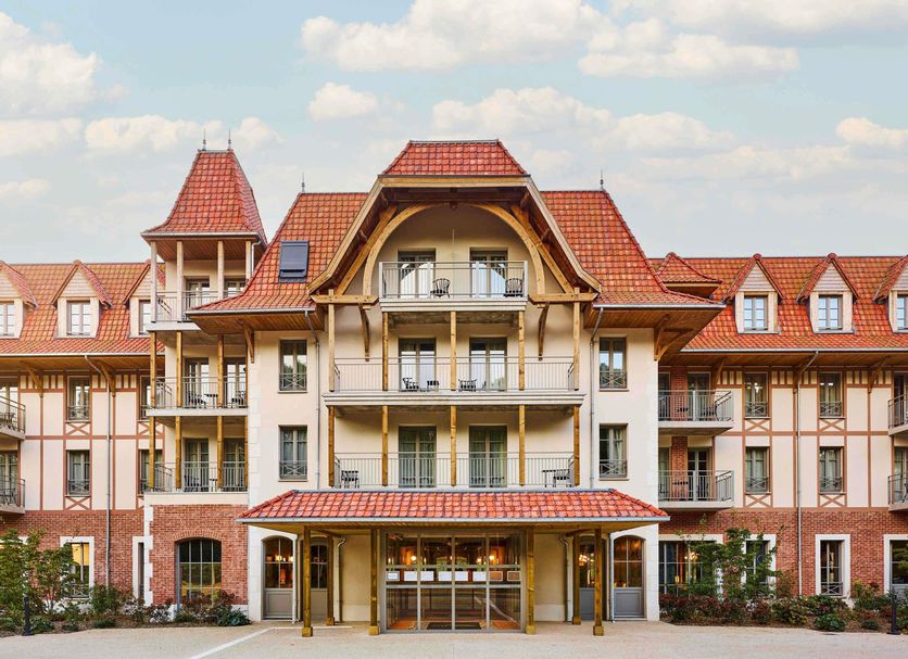Tribe Le Touquet in Le Touquet, hotel exterior with red-tiled roof and balconies