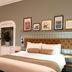 The Hawes Inn by Innkeeper's Collection in South Queensferry, a bedroom with king bed, sofa and wall art