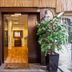 Sun City Hotel in Tel Aviv entrance with open doorway, wood floor, and potted plant