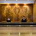 Aston Manado Hotel lobby front desk with two staff members in Manado
