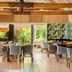 Musket Cove Island Resort and Marina dining room on Malolo Island with tropical garden views and patterned chairs