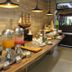 Grand Santhi Hotel Denpasar breakfast buffet with juice dispensers and pastries