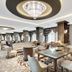 Tui Magic Life Jacaranda, Side: elegant hotel lounge with patterned carpet, chandeliers and seating area