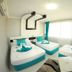 Park Vadi Hotel, Diyarbakır: bright twin room with turquoise accents, large window, and seating area