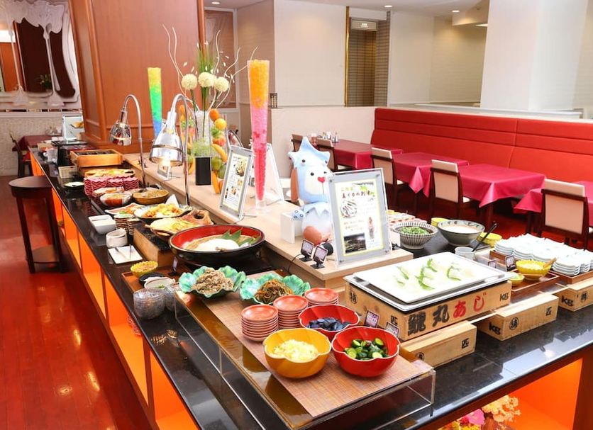 Hotel Hokke Club Hakodate breakfast buffet with colorful dishes and red seating in Hakodate