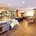 Hotel Döllnsee-Schorfheide in Templin breakfast buffet and dining room with wood flooring