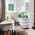 Unikat Guest Rooms Krakow: bright guest room with table, kitchenette, and doorway to carpeted bedroom