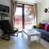 Flora Daisy Apartment in Borovets living room with sofa, TV, coffee table and balcony doors