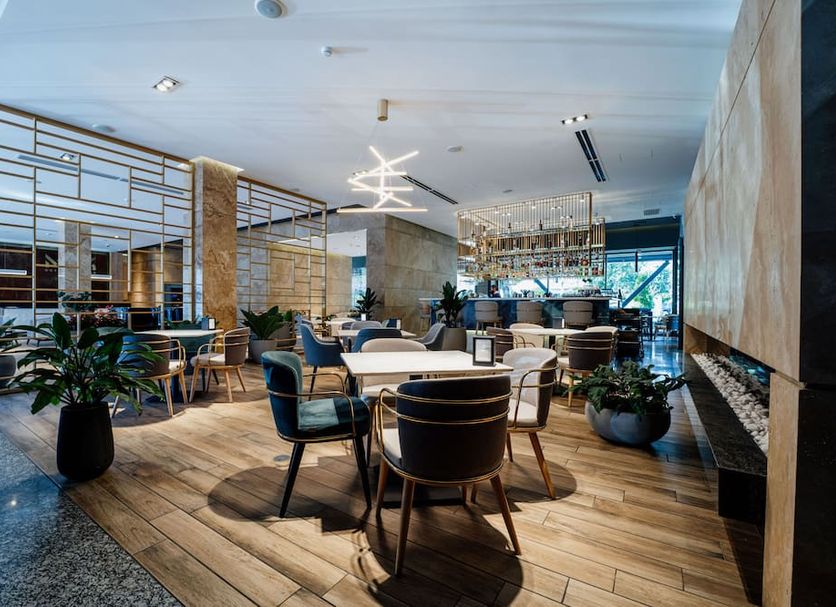 Messier 53 Hotel Yerevan lobby lounge with seating, fireplace and city views in Yerevan