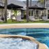 Ballina Byron Islander Resort and Conference Centre in Ballina poolside loungers and umbrellas beside a spa