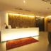 Extreme Boutique Hotel Kluang lobby with illuminated front desk, red rug, and seating area
