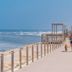 Parque de Campismo Orbitur Vagueira in Gafanha da Boa Hora, boardwalk by the ocean with people walking