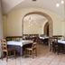 La Vecchia Torre in San Nicola Manfredi dining room with arched brick openings and set tables
