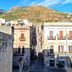 Case D'anna in Castellammare del Golfo with a street view toward mountain hills and old buildings