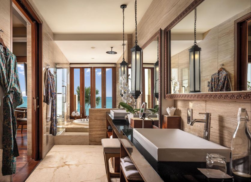 The Seminyak Beach Resort & Spa in Kuta bathroom with double vanity and ocean view beyond