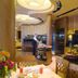 Hotel Europa in Bibione buffet dining area with food display, seating and warm wood interior