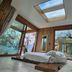 EcoResort Il Cantico della Natura in Magione, airy room with skylight, glass walls and lake view