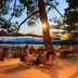 Grand Hôtel De Cala Rossa terrace dining by the sea at sunset in Porto-Vecchio