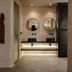 Emery Hotel in Naxos bathroom vanity with double round mirrors and under-shelf lighting