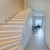 Plakias Resorts in Plakias: bright hallway with lit staircase, vanity bathroom, and sea view ahead