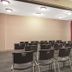 Meeting room at Baymont by Wyndham Laurel with rows of chairs and overhead lights in Laurel