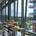 AC Hotels by Marriott Tallahassee Universities at the Capitol buffet setup in a glass-walled hallway with city views