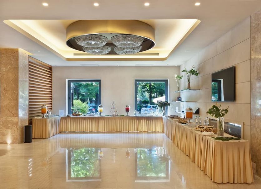 Fh55 Grand Hotel Mediterraneo in Florence lobby with buffet tables, polished floors, and large windows